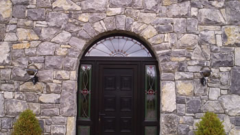 Limestone house - Archway windows and doors