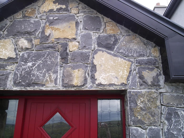 Limestone.Cladding.House.Red.Windows3.700.by.525